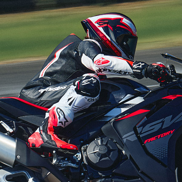 alpinestars_one-piece-suit_leather_gp-tech-v5_black-white-fluo-red_lifestyle4.jpg