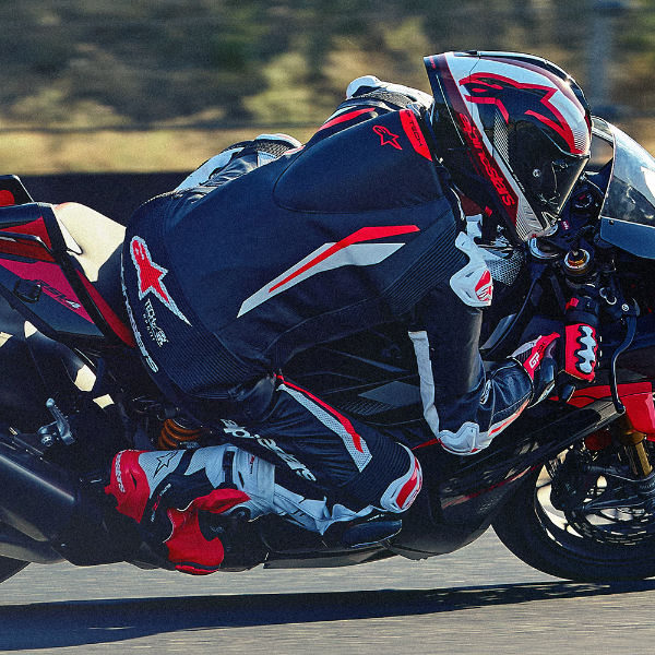 alpinestars_one-piece-suit_leather_gp-tech-v5_black-white-fluo-red_lifestyle5.jpg