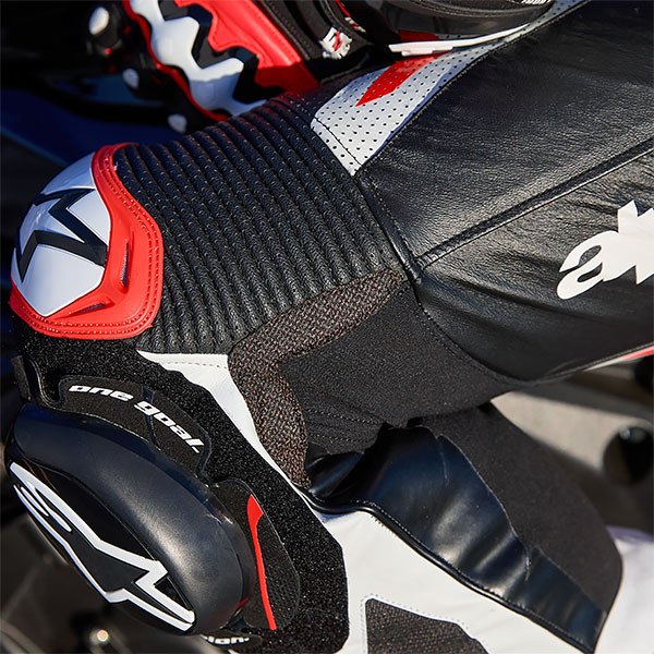 alpinestars_1-piece-suit_gp-tech-v5_black-white-fluo-red_lifestyle1.jpg