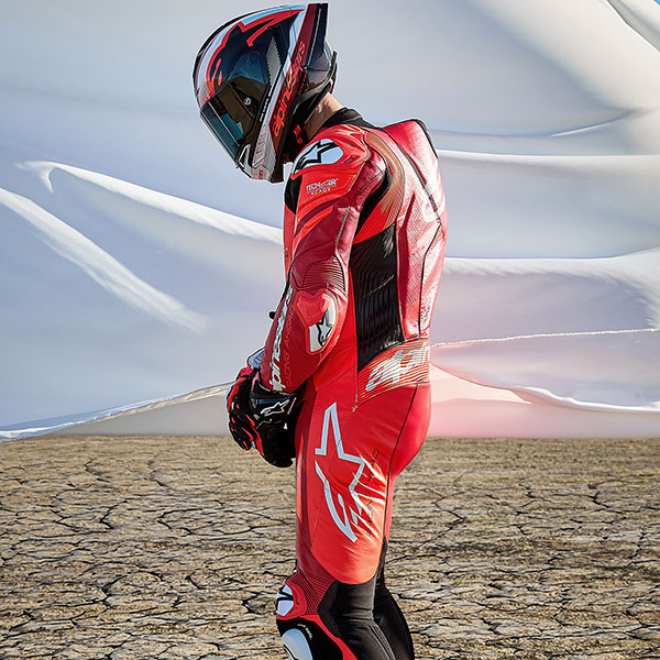 alpinestars_one-piece-suit_leather_gp-plus-v4-sprint_fluo-red-mid-red-white_lifestyle6.jpg